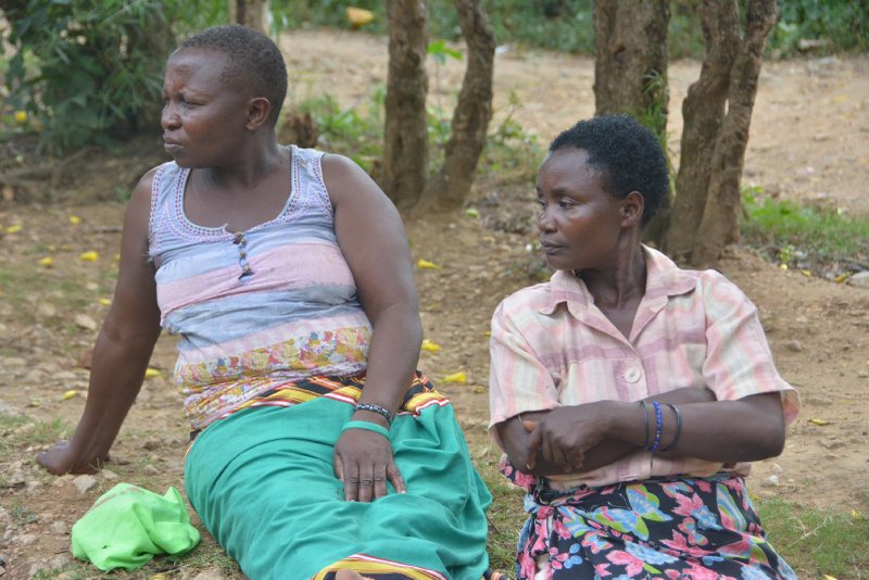 Women sit under a tree outside their home in Mbale, Uganda, Nov. 17, 2018. During the 2020 COVID-19 lockdown, some non-Catholic religious leaders urged women to use contraceptives, but the Catholic Church remains against it. (CNS photo/Tonny Onyulo)