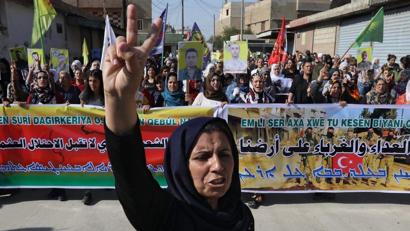 Kurdish and Arab religious persecution protesters chant slogans against Turkish President Recep Tayyip Erdogan as they walk during a march to U.N. headquarters in Qamishli, Syria, Oct. 23, 2019. (CNS photo/Muhammad Hamed Reuters)
