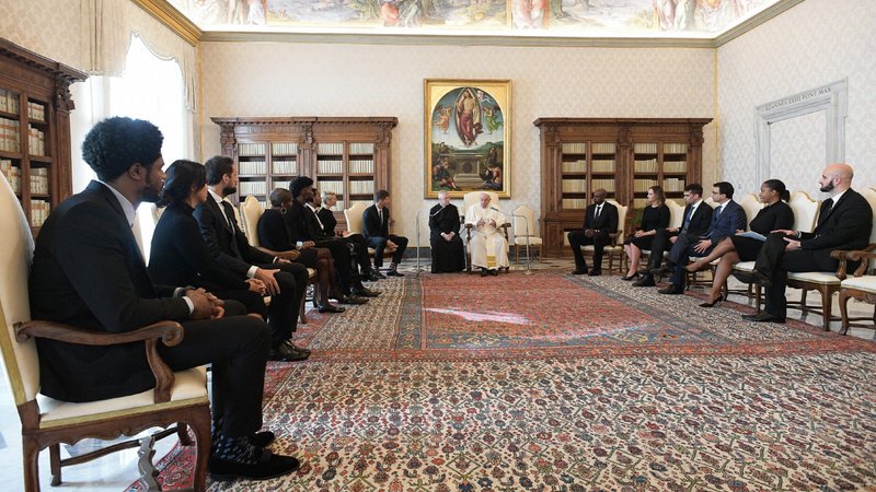 Pope Francis meets with a delegation from the National Basketball Players Association during a private audience at the Vatican Nov. 23, 2020. The group included Marco Belinelli of the San Antonio Spurs; Sterling Brown of the Milwaukee Bucks; Jonathan Isaac of the Orlando Magic; Kyle Korver of the Milwaukee Bucks; and Anthony Tolliver, a free agent who most recently played for the Memphis Grizzlies. (CNS photo/Vatican Media)