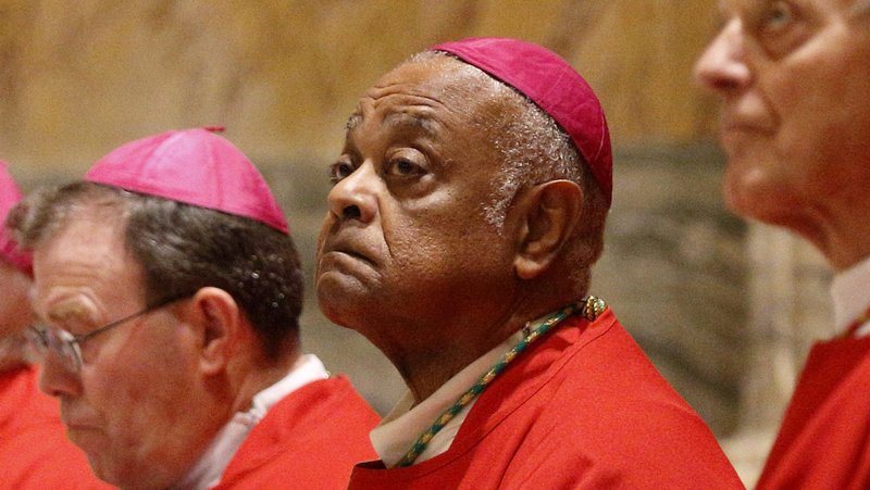Archbishop Wilton D. Gregory of Washington, center, is pictured with other U.S. bishops during a Mass at the Basilica of St. Paul Outside the Walls in Rome in this Dec. 3, 2019, file photo. In a Zoom interview from the Domus Sanctae Marthae, where he is in quarantine before the Nov. 28 consistory, Cardinal-designate Gregory talked about the importance of dialogue for the church and for the United States. (CNS photo/Carol Glatz)