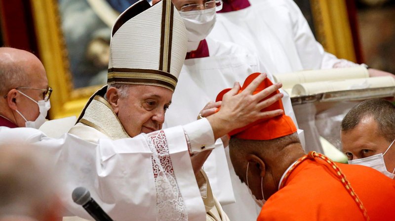 Pope Francis places the red biretta on new Cardinal Wilton D. Gregory of Washington during a consistory in St. Peter's Basilica at the Vatican Nov. 28, 2020. (CNS photo/Fabio Frustaci, Reuters pool)