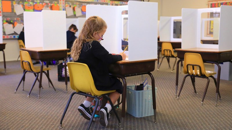A student at St. Maria Goretti School on the first day of in-person instruction Oct. 26. (David Amador Rivera)