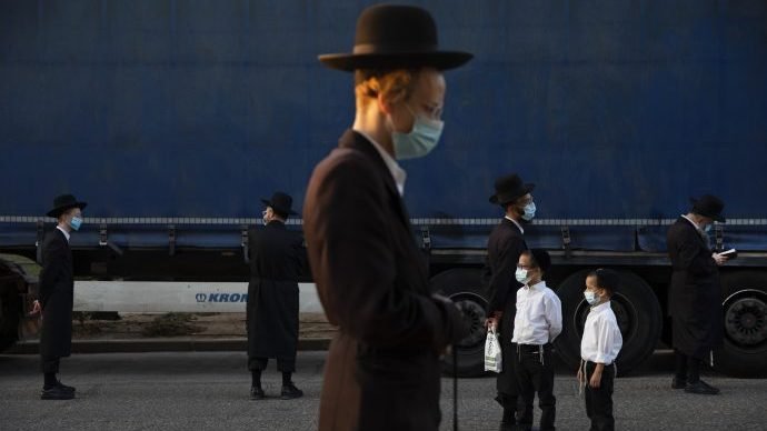 Ultra-Orthodox Jews wear face masks and keep social distancing amid concerns over the country's coronavirus outbreak, during a protest to what they say is incitement against the city and country's religious population, in the southern Israel city of Arad, Monday, Oct 19, 2020. (Oded Balilty/AP via Cruz)