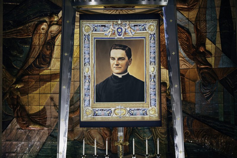 A giant tapestry with a portrait of Bl. Michael McGivney, founder of the Knights of Columbus, during his beatification Mass Oct. 31 at the Cathedral of St. Joseph in Hartford, Connecticut. (Catholic News Service/Courtesy Knights of Columbus)