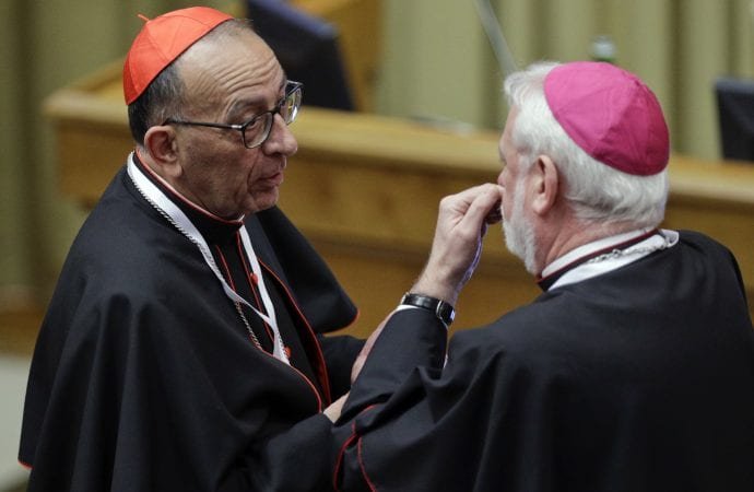 Juan José Omella, Archbishop of Barcelona, Spain, left, talks with Vatican Secretary for Relations with States Paul Gallagher during a conference of EU politicians on re-thinking Europe, at the Vatican, Saturday, Oct. 28, 2017. (Andrew Medichini/AP.)