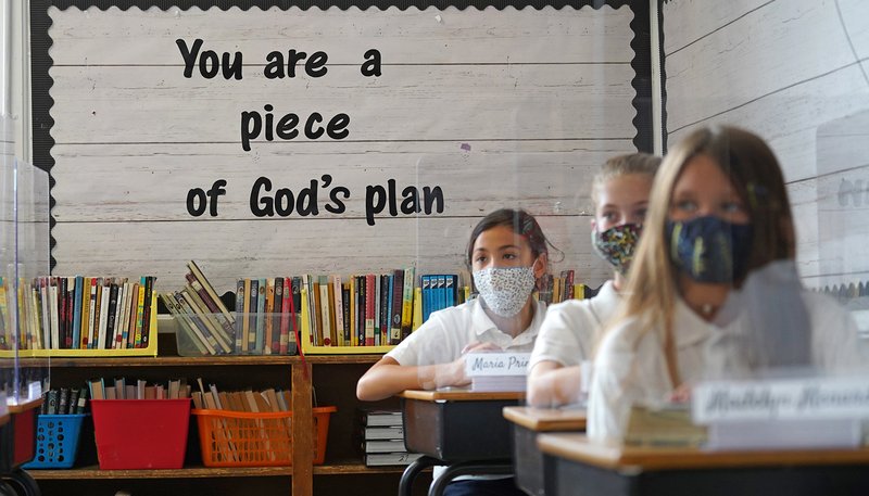 Sixth-graders sit at their desks on the first day of classes of the new academic year at Our Lady of Victory School in Floral Park, New York, Sept. 8, amid the COVID-19 pandemic. (CNS photo/Gregory A. Shemitz)