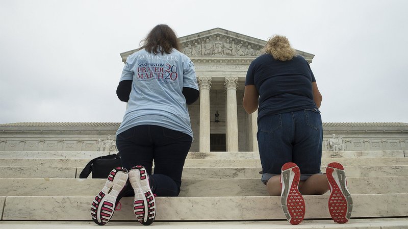 People pray outside the U.S. Supreme Court in Washington Sept. 26, 2020. (CNS photo/Tyler Orsburn)