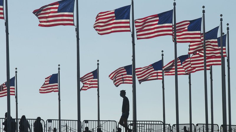 People are seen near the Washington Monument in Washington Nov. 28, 2020. The U.S. Supreme Court Nov. 30 heard oral arguments in a case brought by the Trump administration to exclude from the census those in the U.S. without legal documentation. (CNS photo/Tyler Orsburn)