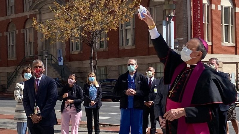 Baltimore Archbishop William E. Lori blesses the University of Maryland Medical Center in Baltimore April 8, 2020, amid the coronavirus pandemic. (CNS photo/Kevin J. Parks, Catholic Review)