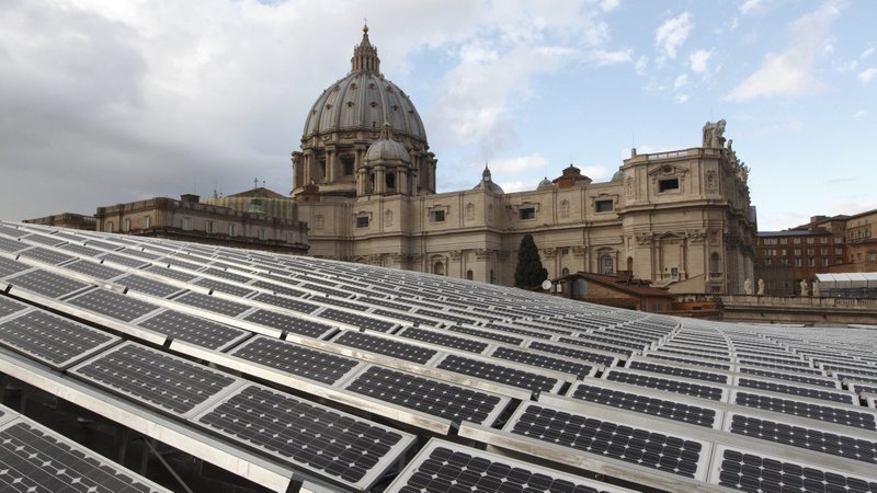 Solar panels are seen on the roof of the Paul VI audience hall at the Vatican in this Dec. 1, 2010, file photo. In a videomessage, Pope Francis told the Virtual Climate Ambition Summit that Vatican City is aiming for net zero carbon emissions. (CNS photo/Paul Haring)