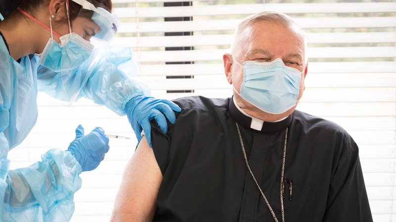 Archbishop Thomas G. Wenski of Miami receives the Pfizer/BioNTech COVID-19 vaccine Dec. 16, 2020, at St. John's Nursing Center for Care & Rehab in Fort Lauderdale, Fla., a part of Catholic Health Services of the Archdiocese of Miami. Archbishop Wenski said he is encouraging coronavirus vaccinations as morally ethical and a public good as the pandemic continues to rage. (CNS photo/Tom Tracy)