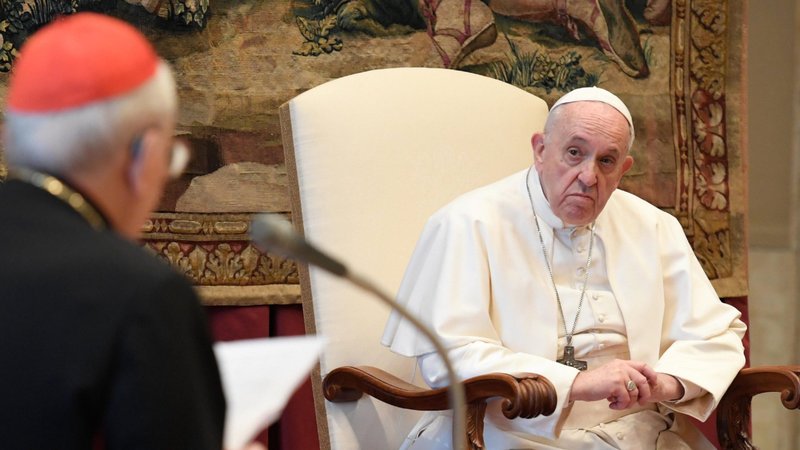 Pope Francis listens as Cardinal Giovanni Battista Re, dean of the College of Cardinals, expresses his best wishes to the pope during an audience with officials of the Roman Curia at the Vatican Dec. 21, 2020. (CNS photo/Vatican Media)