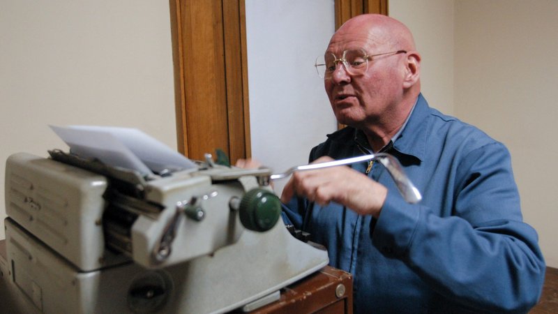 Famous for his homework sheets created on a manual typewriter, Discalced Carmelite Father Reginald Foster is seen working in his Vatican office in this January 2007 file photo. The Vatican Latinist and teacher of Latin died Dec. 25, 2020, in Milwaukee, Wisconsin. (CNS photo/Chris Warde-Jones)