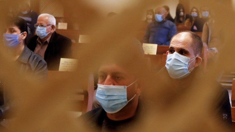 Iraqis in Baghdad wear protective face masks during Christmas Mass at St. Elya Chaldean Catholic Church Dec. 25, 2020. (CNS photo/Khalid al-Mousily, Reuters)
