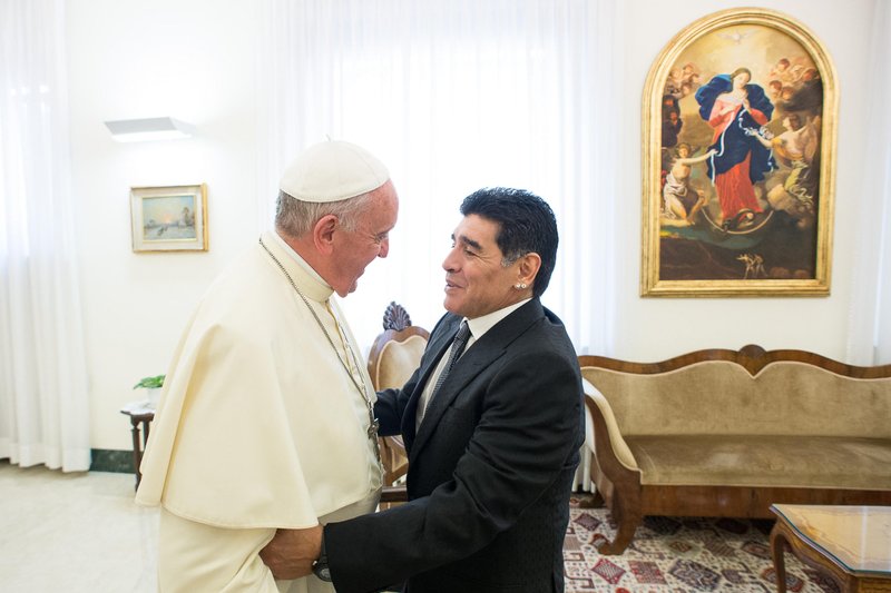 Pope Francis greets Diego Maradona at the Vatican in 2014. The former soccer star died of heart failure Nov. 25 at the age of 60. (Filippo Monteforte/AFP via Getty Images)