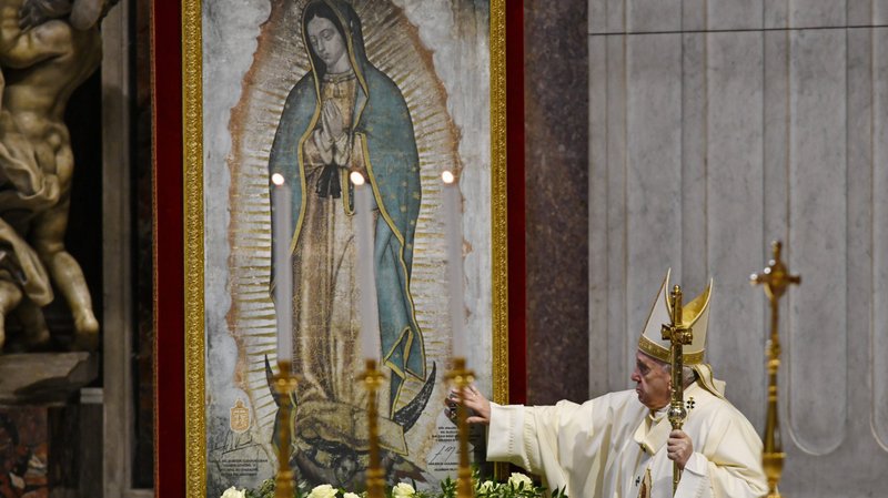 Pope Francis touches an image of Our Lady of Guadalupe as he celebrates Mass marking the feast of Our Lady of Guadalupe in St. Peter's Basilica at the Vatican Dec. 12, 2020. (CNS photo/Paolo Galosi, pool)