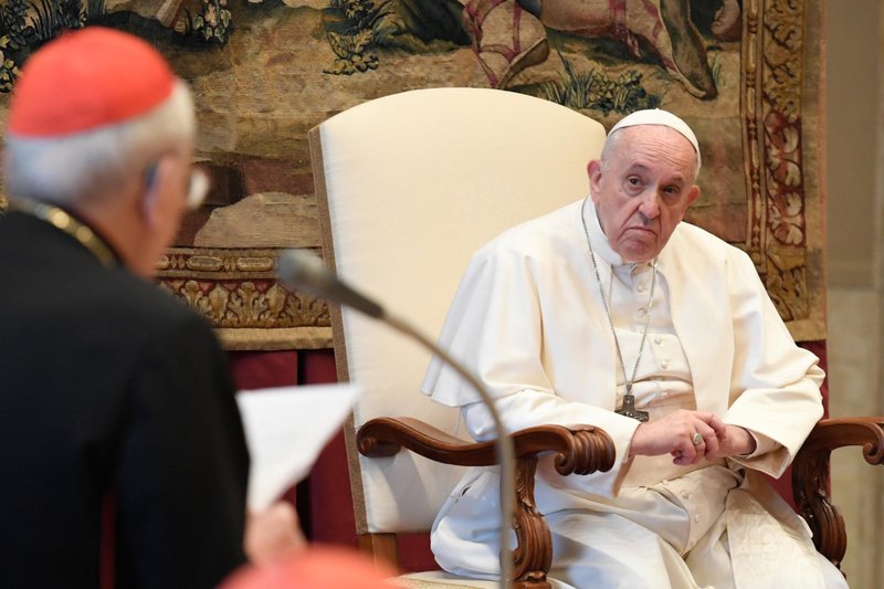 Pope Francis listens as Cardinal Giovanni Battista Re, dean of the College of Cardinals, expresses his best wishes to the pope during an audience with officials of the Roman Curia at the Vatican Dec. 21, 2020. (CNS photo/Vatican Media)