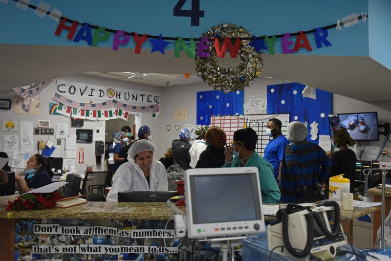 Health care workers at United Memorial Medical Center in Houston treat patients infected with COVID-19 on New Year's Eve Dec. 31, 2020. (CNS photo/Callaghan O'Hare, Reuters)