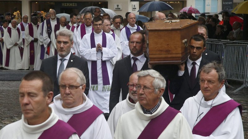Pallbearers carry the coffin of Father Jacques Hamel Aug. 2, 2016, outside the cathedral in Rouen, France. Father Hamel was murdered by Islamists during Mass at his Normandy church that July. (CNS photo/Jacky Naegelen, Reuters)