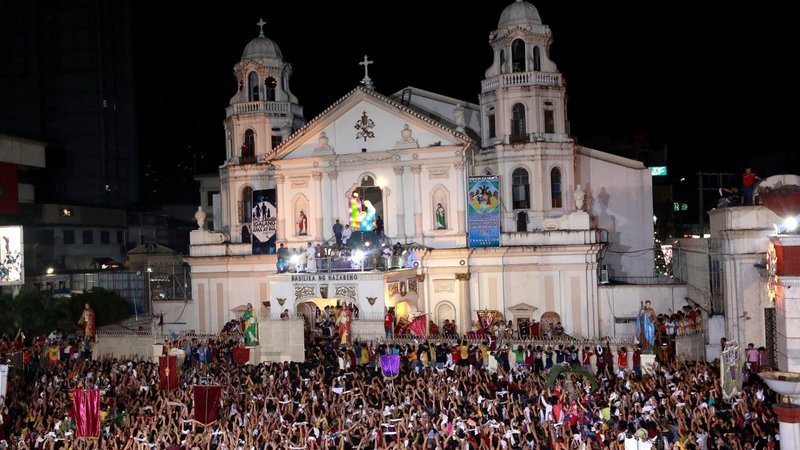 Worshippers gather in front of the Minor Basilica of the Black Nazarene in Manila, Philippines, Jan. 10, 2019. Working with government authorities to prevent the spread of COVID-19, church officials are taking measures to reach out to the millions who normally participate in the celebration marking the 1787 transfer of the statue to the basilica. (CNS photo/Soe Zeya Tun, Reuters)