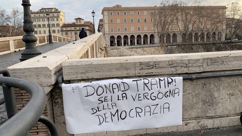A sign in Italian reads, "Donald Tramp, you are an embarrassment to democracy," near the Ponte Sisto bridge in Rome Jan. 7, 2021. (CNS photo/Cindy Wooden)