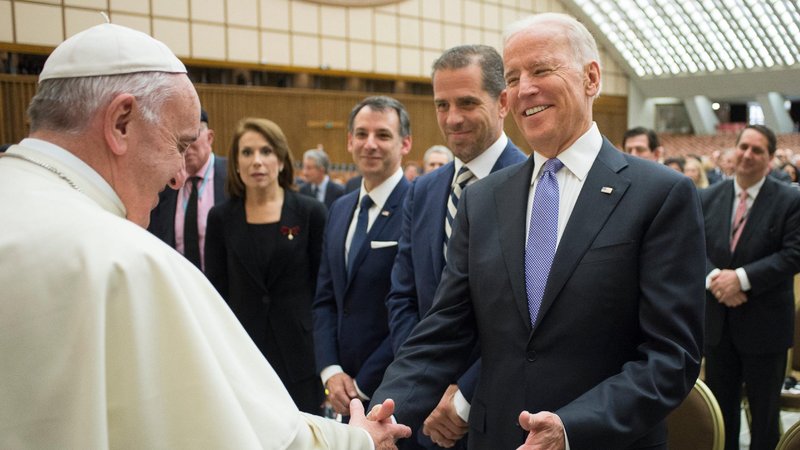 Pope Francis greets U.S. Vice President Joe Biden after both spoke at a conference on adult stem cell research at the Vatican April 29, 2016. The pope sent a written message to Biden upon his Jan. 20 inauguration as president of the United States. (CNS photo/Vatican Media)
