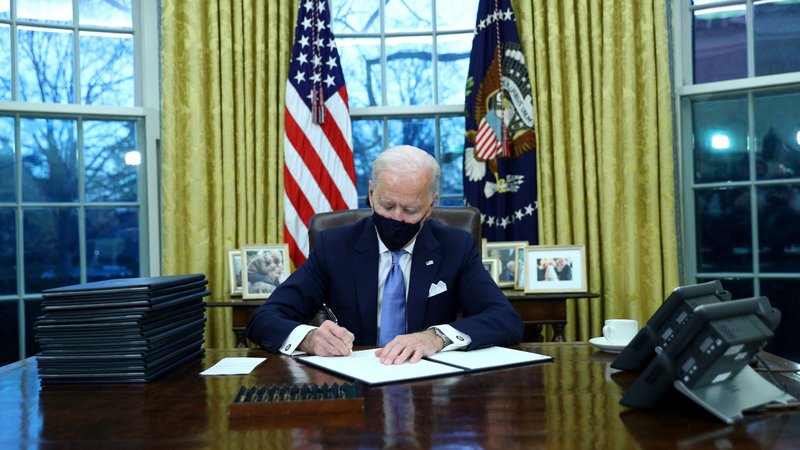 President Joe Biden signs executive orders at the White House in Washington Jan. 20, 2021, after his inauguration as the 46th president of the United States. (CNS photo/Tom Brenner, Reuters)