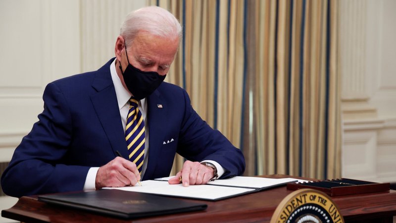 President Joe Biden signs executive orders at the White House in Washington Jan. 22, 2021. (CNS photo/Jonathan Ernst, Reuters)