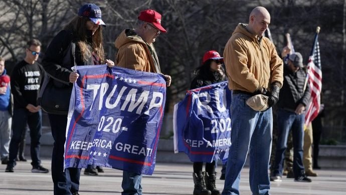 People take part in a rally at the Legislative Plaza, Wednesday, Jan. 6, 2021, in Nashville, Tenn. Two Tennessee lawmakers organized a prayer rally on Wednesday timed to coincide with a protest in the nation's Capitol in support of President Donald Trump's baseless claims that he won reelection. (AP Photo/Mark Humphrey via Crux)