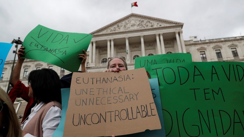 Demonstrators protest euthanasia in front of the parliament in Lisbon, Portugal, May 29, 2018. (CNS photo/Rafael Marchante, Reuters)