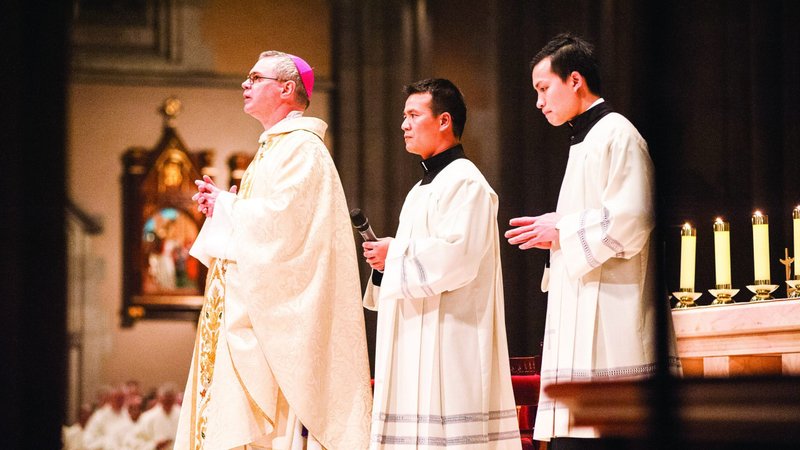 Australian Archbishop Peter Comensoli of Melbourne prays during his installation Mass in St. Patrick's Cathedral Aug. 1, 2018. (CNS photo/John Casamento, Catholic Weekly)