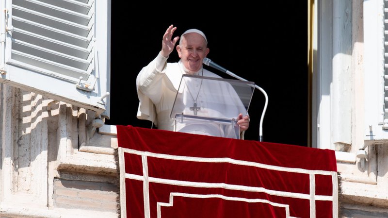 Pope Francis greets the crowd as he leads the Angelus from the window of his studio overlooking St. Peter's Square at the Vatican Feb. 21, 2021. Pope Francis said that faith, prayer and penance are the weapons Christians are given to overcome temptations from the devil. (CNS photo/Vatican Media)