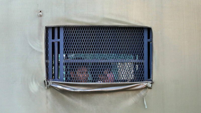 Myanmar migrants to be deported are pictured inside an immigration truck in Lumut, Malaysia, Feb. 23, 2021. Catholic bishops in Malaysia are urging the government to refrain from deporting hundreds of Myanmar nationals, including refugees and asylum-seekers.(CNS photo/Lim Huey Teng, Reuters)