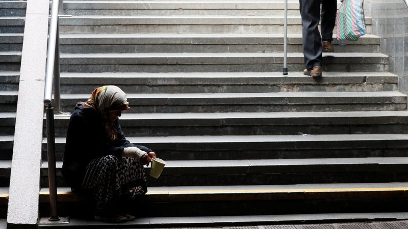 An elderly woman in Kyiv, Ukraine, begs for money in an underpass Sept. 11, 2020, amid the coronavirus pandemic. (CNS photo/Gleb Garanich, Reuters)