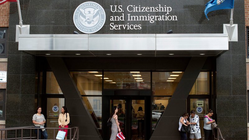 People in New York City stand on the steps of the U.S. Citizenship and Immigration Services office Aug. 15, 2012. (CNS photo/Keith Bedford, Reuters)