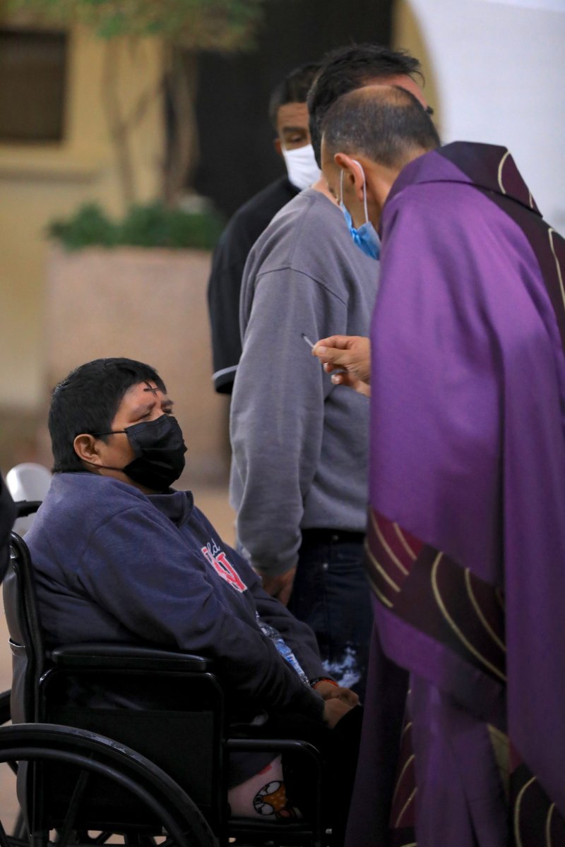 Fr. Arturo Corral distributes ashes at Our Lady Queen of Angels (La Placita) in downtown LA Feb. 17 (David Amador Rivera)