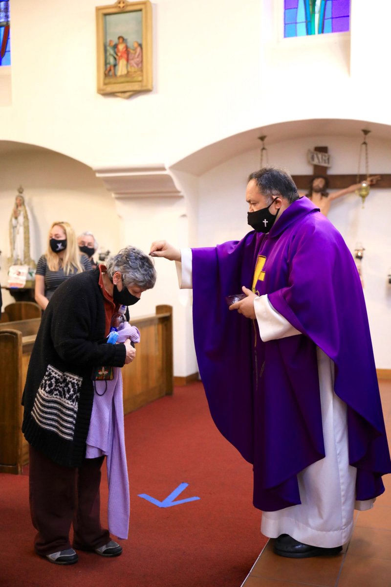 Fr. Domingos Machado, O.A.R., distributes ashes at Cristo Rey Church in Atwater Village Feb. 17. (David Amador Rivera)