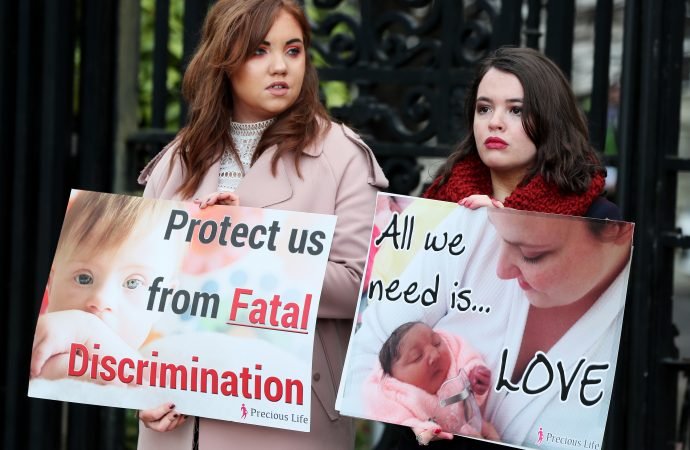 Pro-life supporters are seen in a 2019 file photo holding signs outside the High Court in Belfast, Northern Ireland. (Brian Lawless/Reuters via CNS)