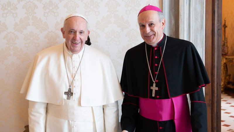 Pope Francis poses with Archbishop Gabriele Caccia, the Vatican's permanent observer to the United Nations, Jan. 11, 2021, in the library of the Apostolic Palace at the Vatican. (CNS photo/Vatican Media)