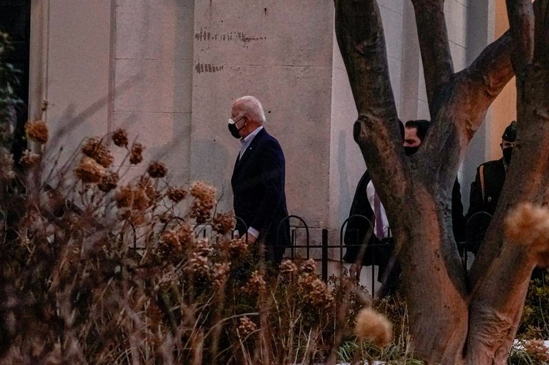 President Joe Biden walks into Holy Trinity Catholic Church to attend Mass in Washington Feb. 20, 2021. (CNS photo/Ken Cedeno, Reuters)
