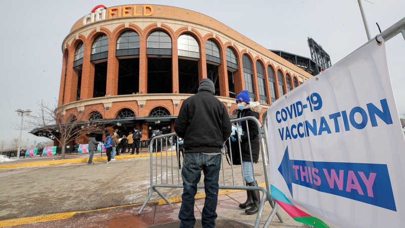 A man in the Queens borough of New York City arrives to receive the COVID-19 vaccine outside Citi Field Feb. 10, 2021, home of the New York Mets. (CNS photo/Brendan McDermid, Reuters)