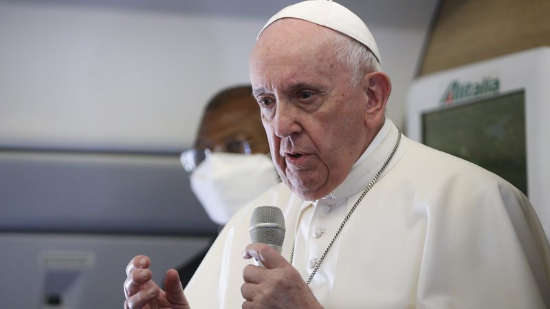 Pope Francis speaks with journalists aboard his flight from Baghdad to Rome March 8, 2021. (CNS photo/Paul Haring)