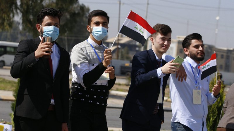 People line the motorcade route for Pope Francis' visit to the community at the Church of the Immaculate Conception in Qaraqosh, Iraq, March 7, 2021. (CNS photo/Paul Haring)
