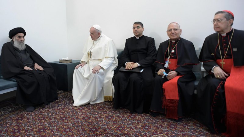 Ayatollah Ali al-Sistani, one of Shiite Islam's most authoritative figures, meets with Pope Francis March 6, 2021, in Najaf, Iraq. The pope was joined by Father George Ayoub, a translator from the Vatican Secretariat of State, Cardinal Louis Sako, the Chaldean patriarch, and Cardinal Miguel Angel Ayuso, president of the Pontifical Council for Interreligious Dialogue. (CNS photo/Vatican Media)