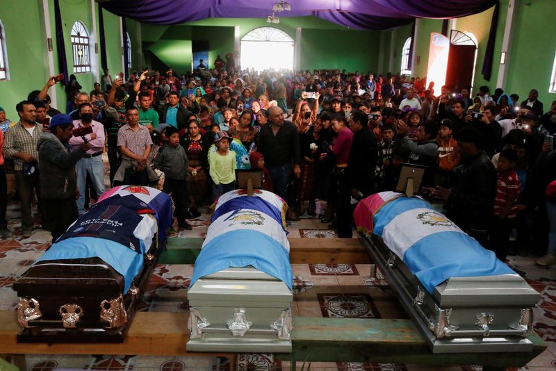 People attend the funeral of Rivaldo Jimenez Ramirez, Santa Cristina Garcia and Ivan Gudiel Pablo, in Comitancillo, Guatemala, March 14, 2021. The migrants were killed in January in Tamaulipas, Mexico, while trying to reach the U.S. to seek asylum. (CNS photo/Luis Echeverria, Reuters)