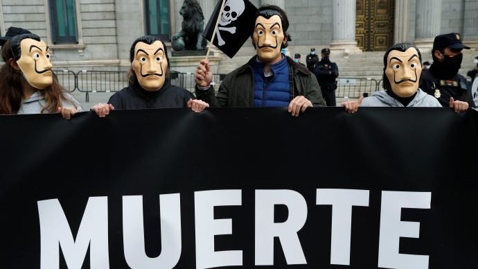 People protest against a law to legalize euthanasia as the Spanish Parliament prepares to vote on it in Madrid in this Dec. 17, 2020, file photo. Spain's parliament was set to pass controversial legislation March 18 legalizing physician-assisted suicide; Belgium, the Netherlands and Luxembourg also allow physician-assisted suicide. (Susana Vera/Reuters via CNS.)