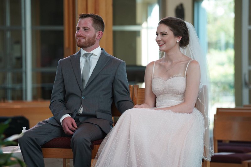 Brandon and Danielle Hegarty are seen in the sanctuary during their wedding Mass at Holy Cross Church in Nesconset, N.Y., Aug. 9, 2020. In a March 19 message to a Rome conference, Pope Francis called for the church's message on marriage to be given in a manner that is encouraging and accessible and not from on high. (CNS photo/Gregory A. Shemitz)