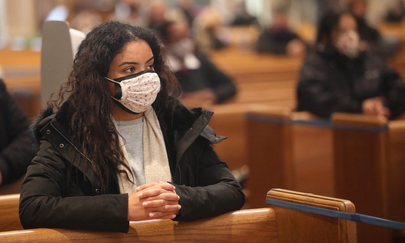 A woman prays during Ash Wednesday Mass at the Cathedral of St. Matthew the Apostle in Washington Feb. 17, 2021, amid the coronavirus pandemic. (CNS photo/Andrew Biraj, Catholic Standard)