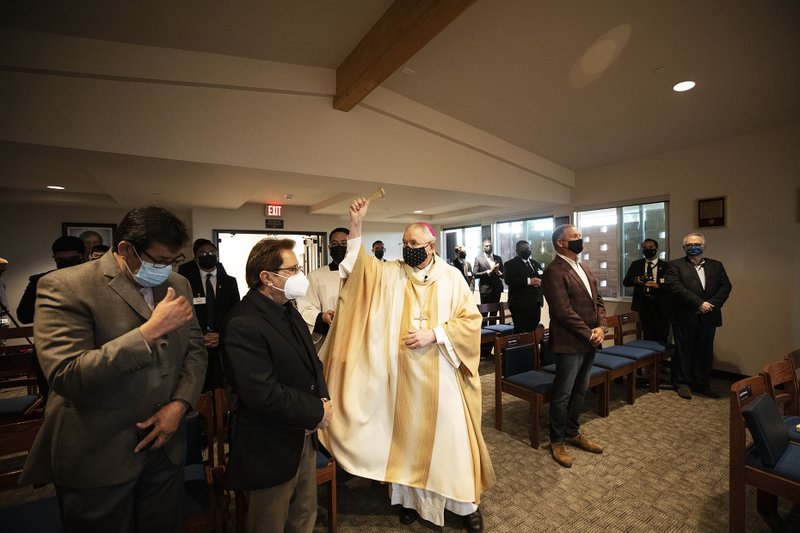 Archbishop Gomez blesses the seminarians who will call the new Queen of Angels center home while they continue their studies for the priesthood. (Victor Alemán)