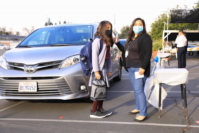 A student arrives at St. Bernard School for in-person learning. (David Amador Rivera)